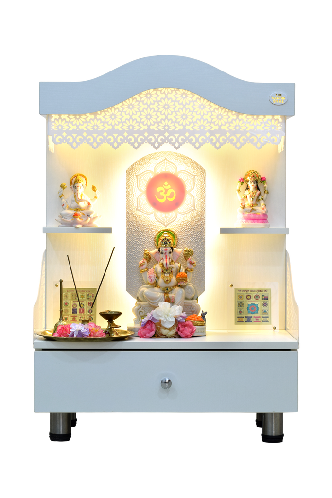 Front view of wooden home temple with golden LED lighting, displaying deity idols and flowers, spacious pooja mandir with drawer storage