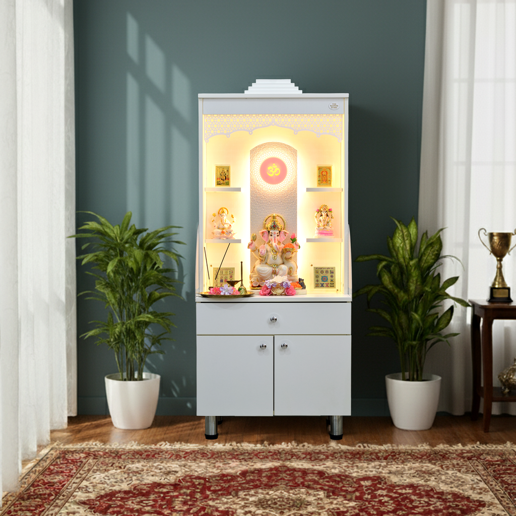 Wooden mandir displayed in home interior with golden LED lighting, potted plants, and traditional home decor against blue wall
