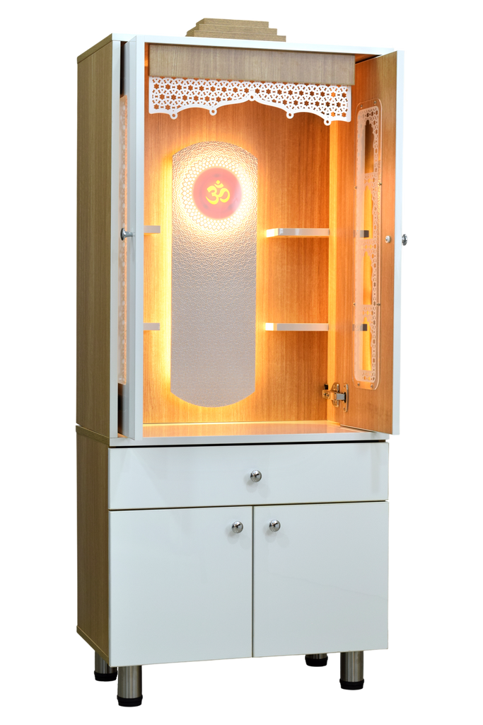 Right side view of mandir showing open pocket doors, revealing spacious interior with warm LED lighting, teakwood shelves, and base storage