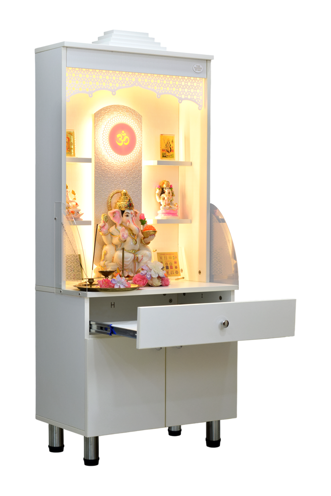 Mandir with extended drawer showing storage compartment and illuminated sanctuary with religious idols and floral offerings
